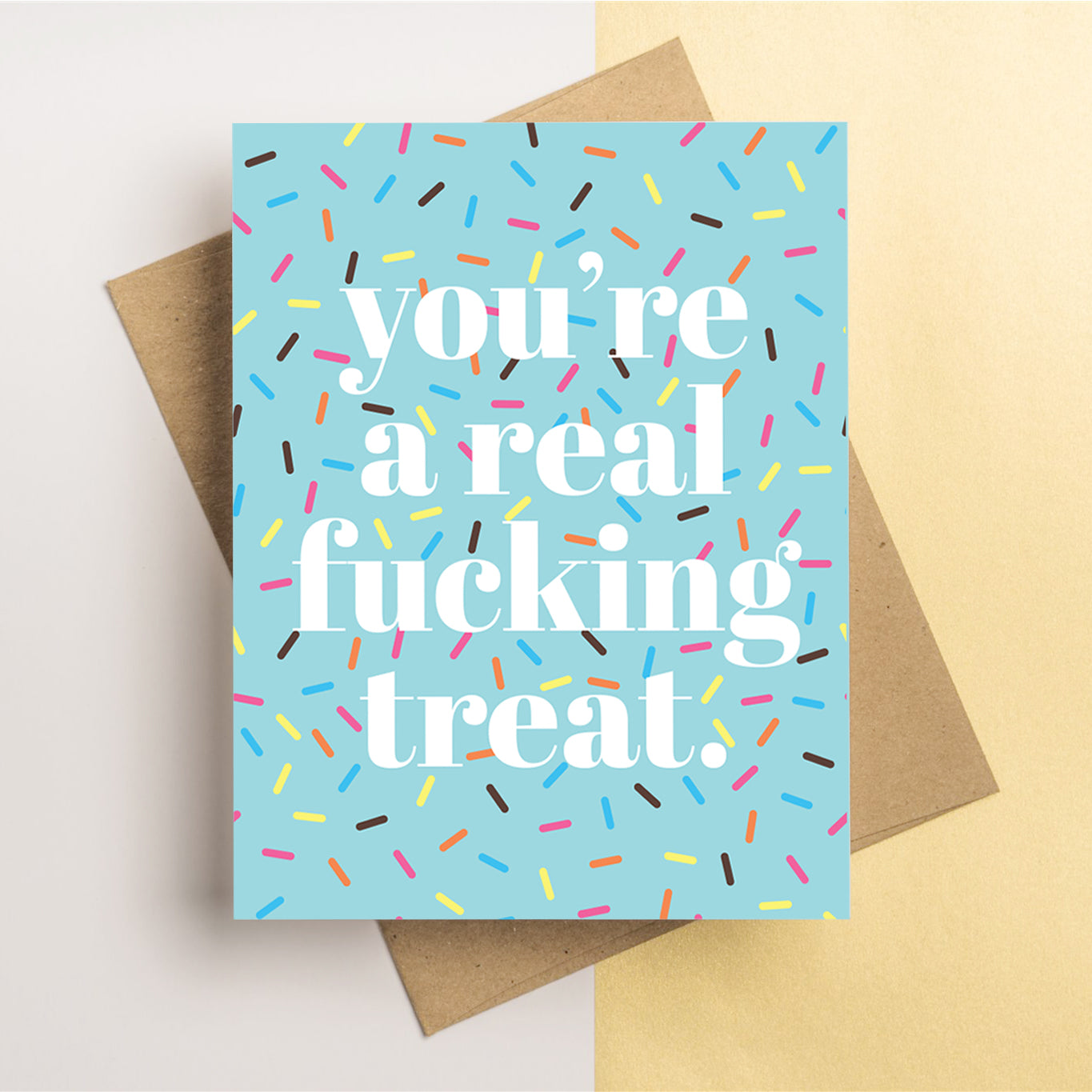Sarcastic Greeting Card for friends or loves that reads "You're a real fucking treat" with sprinkle pattern.